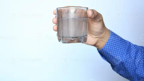 holding-dirty-glass-of-water-photo